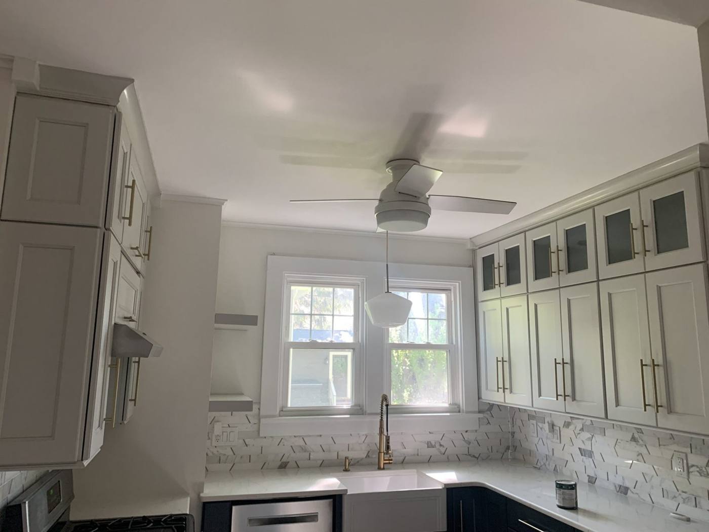 White kitchen with gray walls